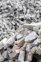 Pile of disassembled gray pavement bricks with selective focus photo