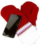 red and white knited mittens with cellphone isolated on white background photo