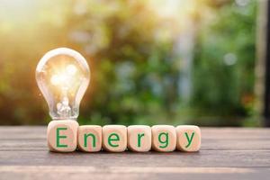protecting the environment alternative energy Sustainable renewable energy sources Green energy innovation and environmentally friendly energy technology,wooden block is placed in front of the lamp