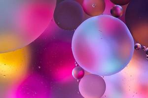 pink and purple surface with abstract round shapes structure of oil in water photo