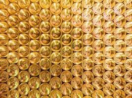 abstract industrial background of shiny brass metal threaded hexagonal parts photo