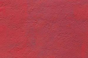 background and texture of flat thick painted matte red surface under direct sunlight photo