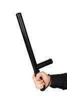 hand in black shirt with black rubber police baton isolated on white background photo