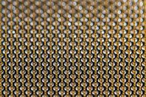 Close-up full frame view of gold plated microprocessor pin array. photo