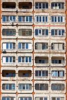 full frame background and texture of typical mid-russian concrete and brick high rise condominium residential building photo