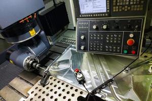 measuring process with ruby touch probe on large CNC milling machine in jog mode photo