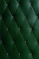 Soviet soft green dermantine front door with a banner of fishing line and nails - full frame background and texture photo