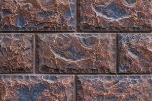 fake brick wall, plastic panel imitating natural stone blocks wall brickwork photo