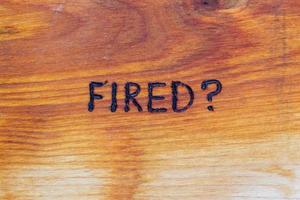 question fired handwritten with hand woodburner on flat brown wood surface photo