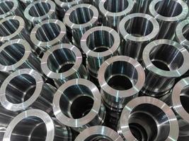 shiny steel production stack background with cnc machined pipes photo