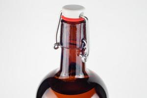 brown bottle swing top or flip-top close-up with selective focus photo