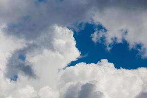 Regular spring clouds on blue sky at daylight in continental europe. Close shot with telephoto lens. photo