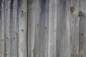 Fondo y textura de la superficie de la pared de tablones de madera seca gris foto