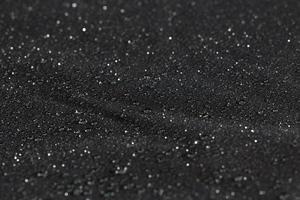 dark gray waterproof hydrophobic flat cloth with rain drops, close-up background photo