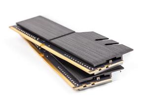 a pair of ddr4 dimm pc ram memoty modules with stylish black heatsinks - isolated on white with selective focus photo