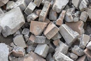 Pile of disassembled gray pavement bricks with selective focus photo