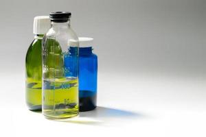 colored medial bottles on gray background with copyspace photo