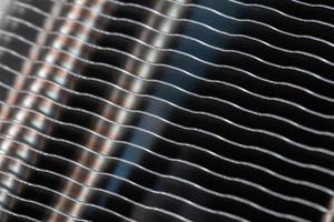 modern tower heat radiator closeup macro background with selective focus photo