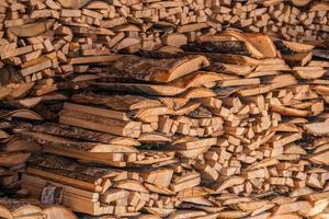 closeup background of firewood lumber leftovers stack with selective focus photo