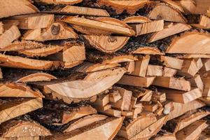 closeup background of firewood lumber leftovers stack with selective focus photo