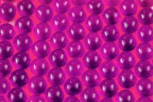 proton purple spherical ball capsules selective focus weird abstract background photo