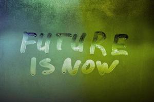 words future is now handwritten on night foggy window glass surface photo