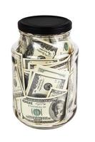 A hundred US dollars bank notes in a glass jar with black cap isolated on white background photo