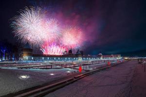 Winter night fireworks over kremlin and Upa quay in Tula, Russia at 2019 photo