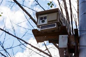 Speed radar camera detector mounted on the pole front closeup telephoto view photo