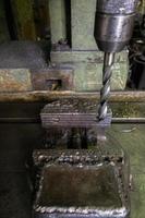 old drilling machine with obsolete used vice with selective focus photo
