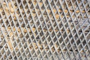 wattle and daub building wall texture and background under direct sunlight at daytime photo