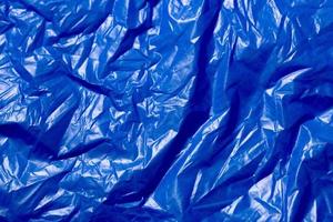 crumpled polyethilene film abstract background with selective focus photo