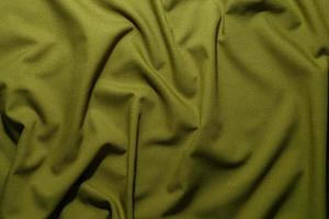 crumpled olive green crumpled tan khaki canvas fabric - full frame background and texture photo