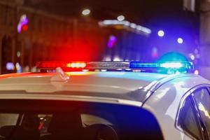 police car lights at night in city with selective focus and bokeh photo