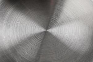 real concentric brushed stainless steel background of new saucepan bottom photo