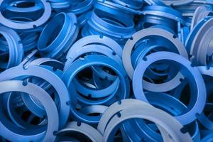 an abstract background of classic blue color coated metal ring parts photo