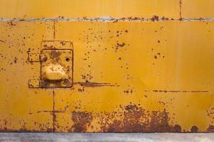 rusted yellow bus board with small hatch photo