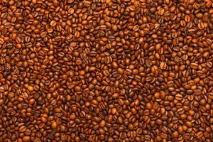 full frame background and texture of roasted coffee beans on flat wooden surface photo