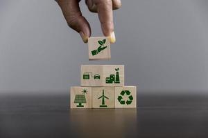 Companies are targeting net zero greenhouse gas emissions. Carbon credit concept.Tradable certificate to drive industry in direction of low emissions in efficiency cost. Wooden cubes with decrease CO2 photo