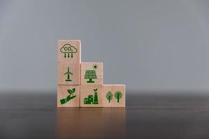 Companies are targeting net zero greenhouse gas emissions. Carbon credit concept.Tradable certificate to drive industry in direction of low emissions in efficiency cost. Wooden cubes with decrease CO2 photo