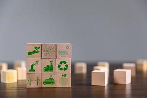 Companies are targeting net zero greenhouse gas emissions. Carbon credit concept.Tradable certificate to drive industry in direction of low emissions in efficiency cost. Wooden cubes with decrease CO2 photo
