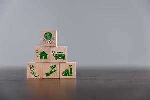 Companies are targeting net zero greenhouse gas emissions. Carbon credit concept.Tradable certificate to drive industry in direction of low emissions in efficiency cost. Wooden cubes with decrease CO2 photo