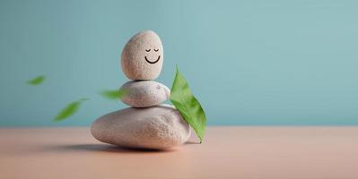 disfrutando de la vida, la armonía y el concepto de mente positiva. pila de piedra de guijarros estable con caricatura de cara sonriente y hoja. sereno, equilibrando cuerpo, mente, alma y espíritu. practica de salud mental foto