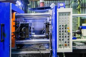 old horizontal die cast aluminium machine - opened, close-up with selective focus photo