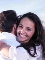 young couple  on beach have fun photo