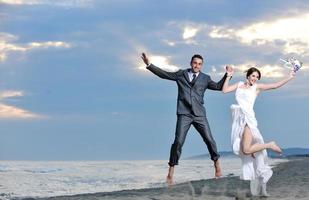 romantic beach wedding at sunset photo