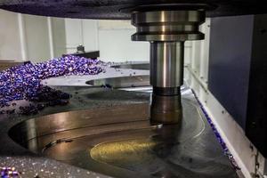 A process of cnc milling of lagre thick steel palte by curved trajectory, Selective focus with blur technique. photo