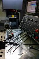 measuring process with ruby touch probe on large CNC milling machine in jog mode photo