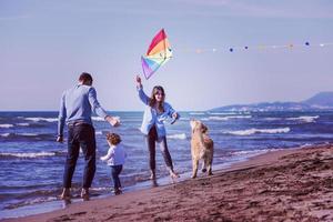 happy young family enjoying vecation during autumn day photo