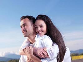 young couple  on beach have fun photo